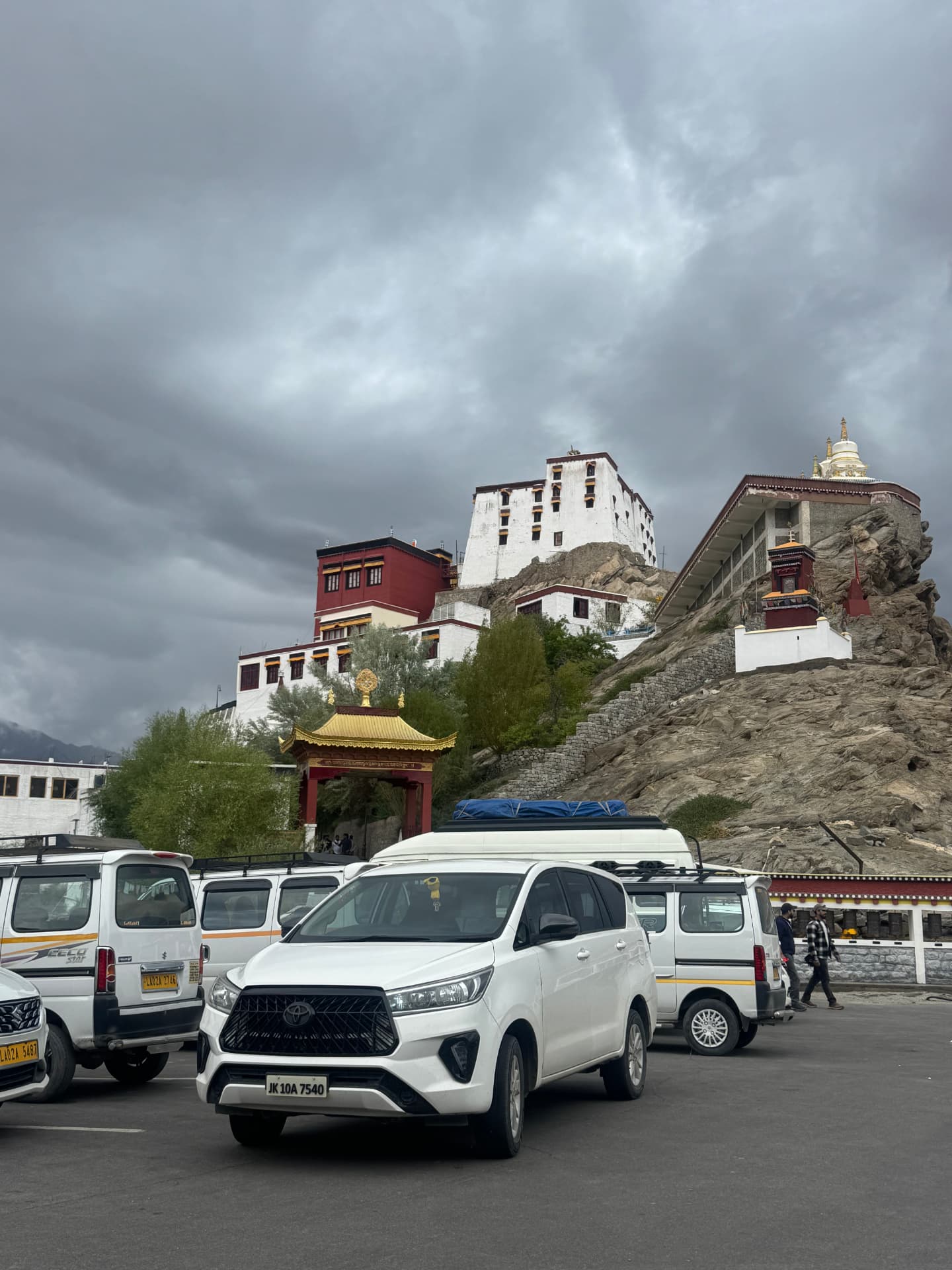 White Toyota Innova at Thiksey monastery parking in Leh